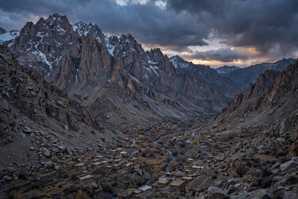 Rugged Hindu Kush mountains above a remote valley village in Afghanistan